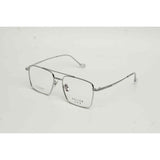 Silver eyeglasses on a light gray background